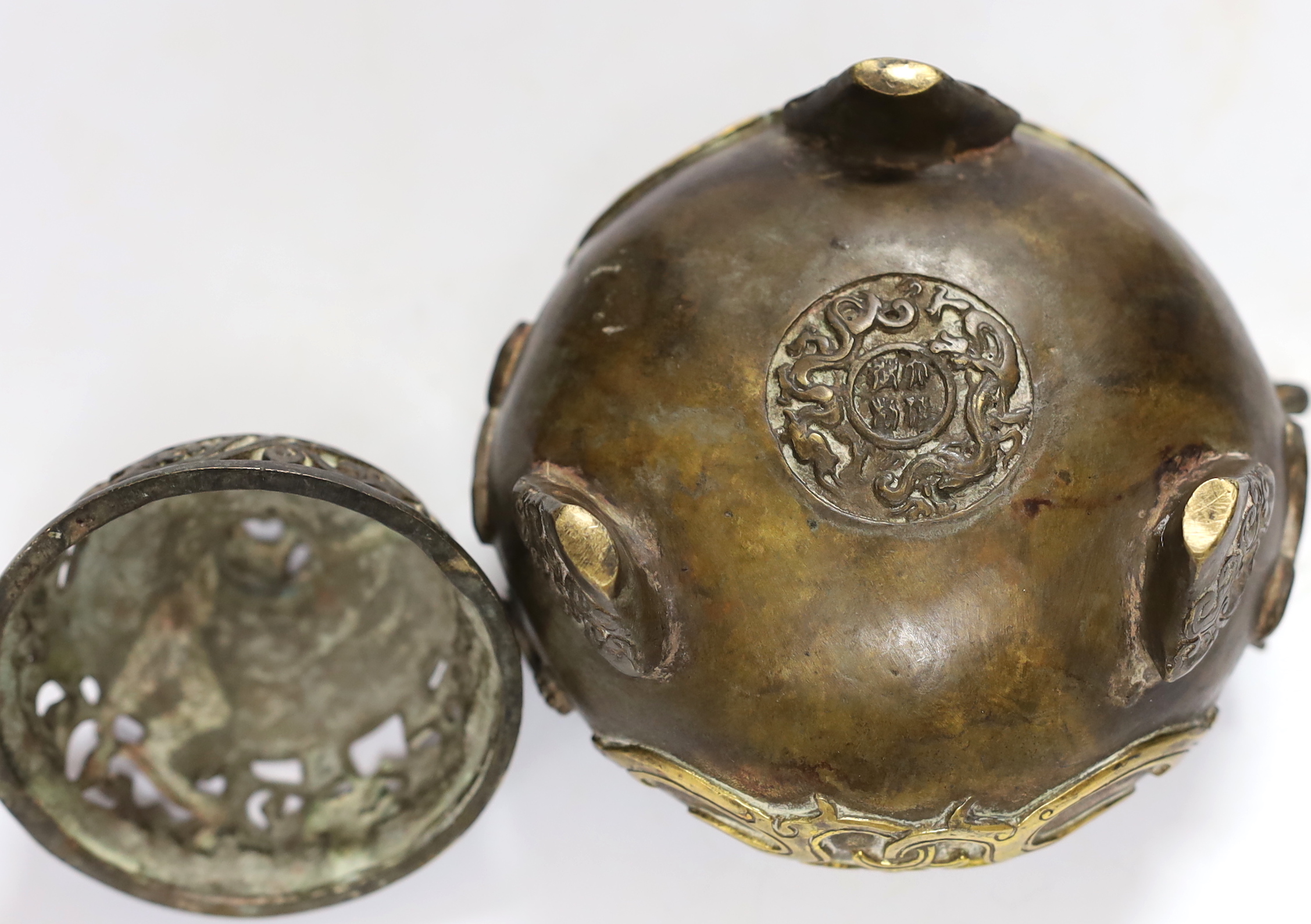 A Chinese parcel gilt bronze censer, with pierced lid and twin zoomorphic handles, 15cm high